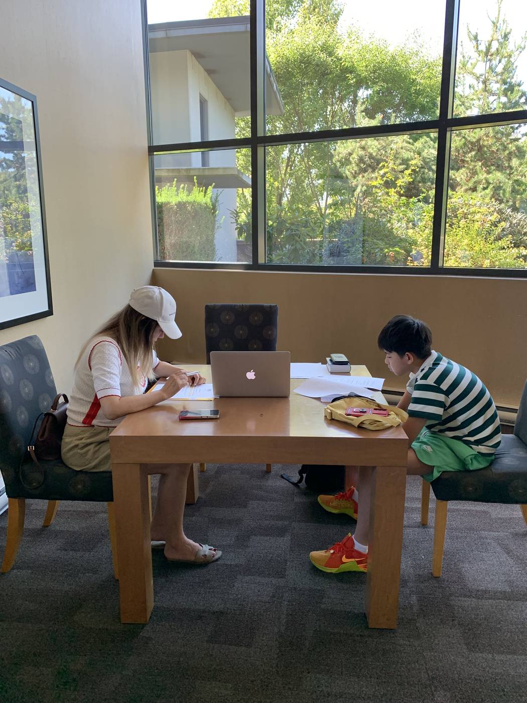 An assistant and client working through a study plan