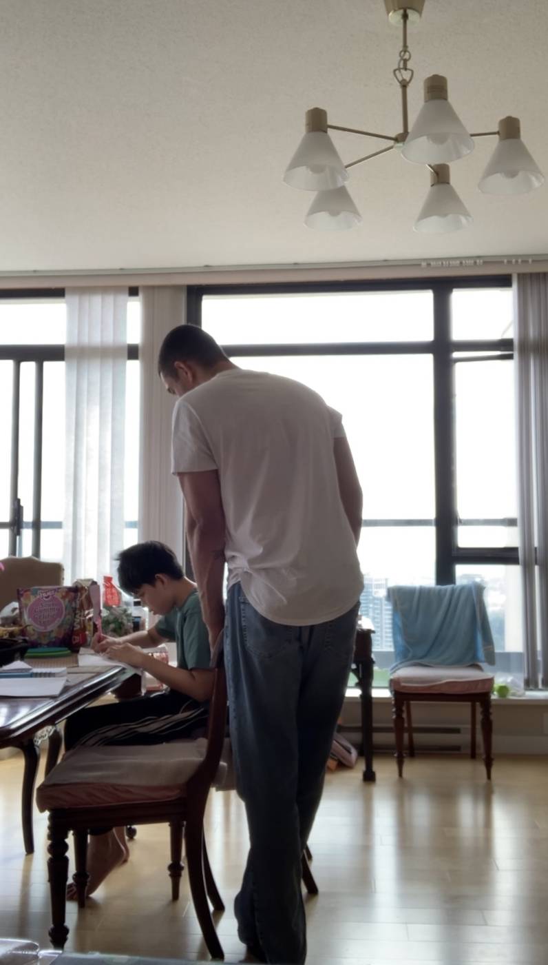 An assistant helping a client with homework at home